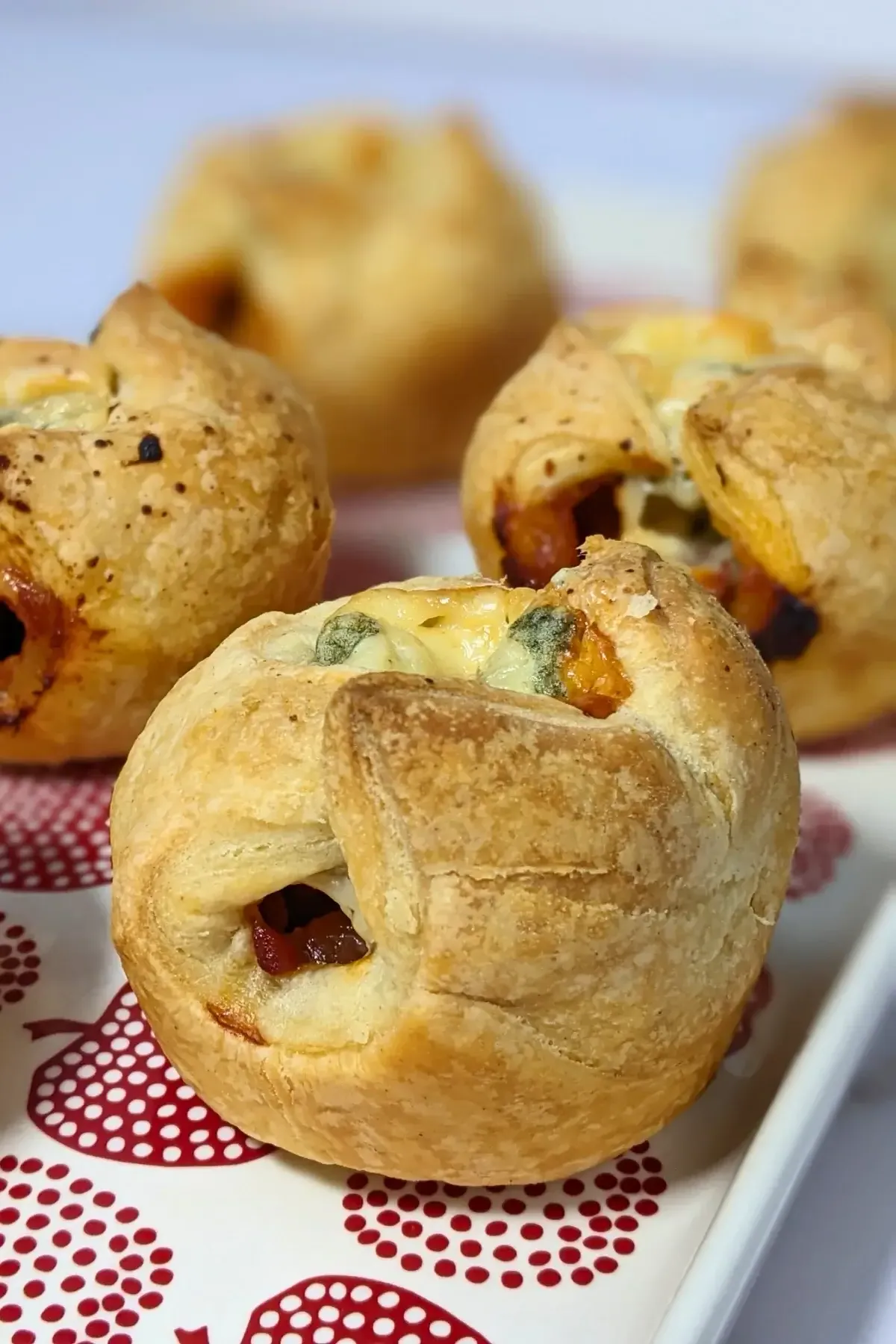 Prosciutto and Blue Cheese Puff Pastry Appetizers - savory puff pastry cups filled with sweet chili sauce, prosciutto and blue cheese.