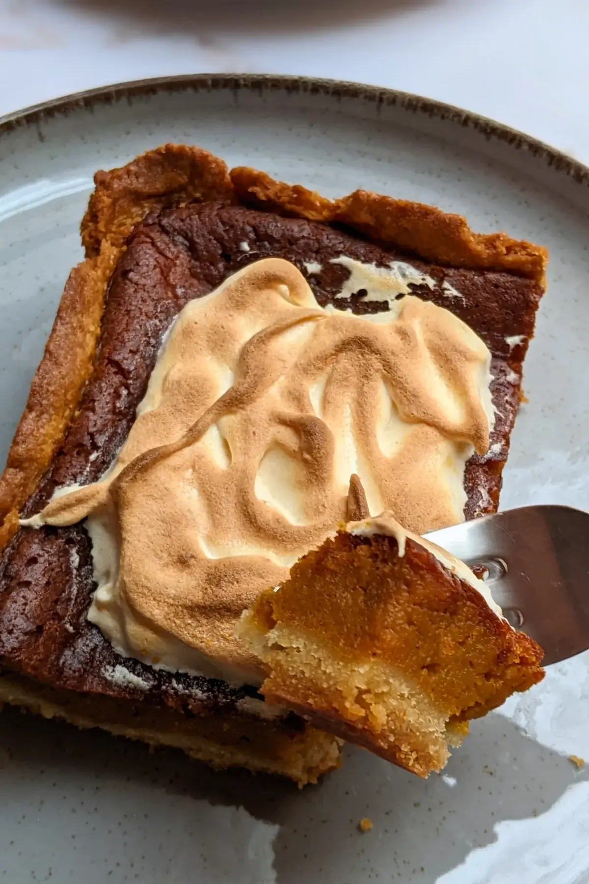 Pumpkin Pie With Toasted Pumpkin Meringue Topping - classic pumpkin pie dessert made with a homemade pumpkin puree and heavy cream filling, full of autumn spices like cinnamon and pumpkin spice, and topped with a pumpkin French meringue.