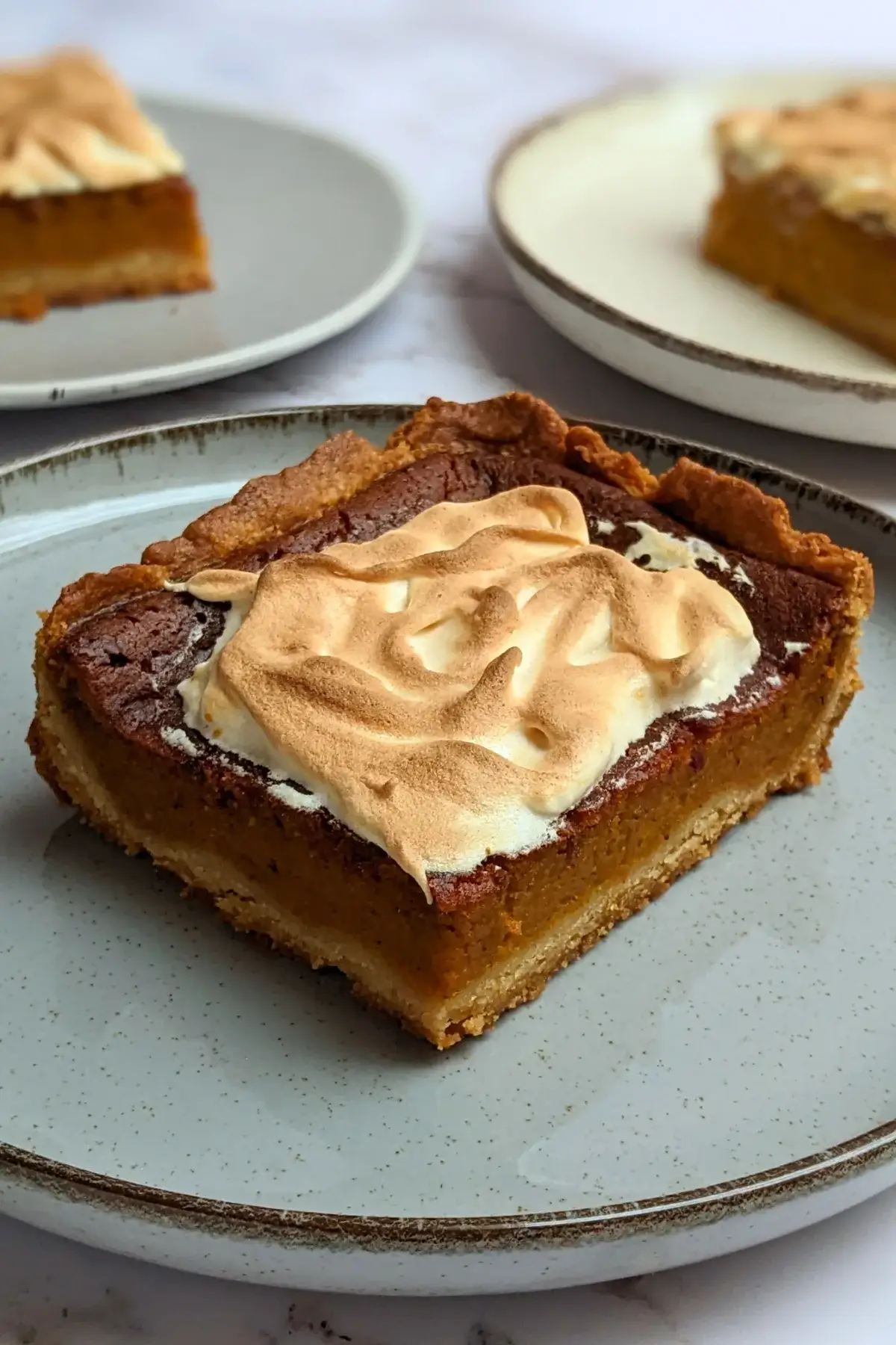 Pumpkin Pie With Toasted Pumpkin Meringue Topping - classic pumpkin pie dessert made with a homemade pumpkin puree and heavy cream filling, full of autumn spices like cinnamon and pumpkin spice, and topped with a pumpkin French meringue. 