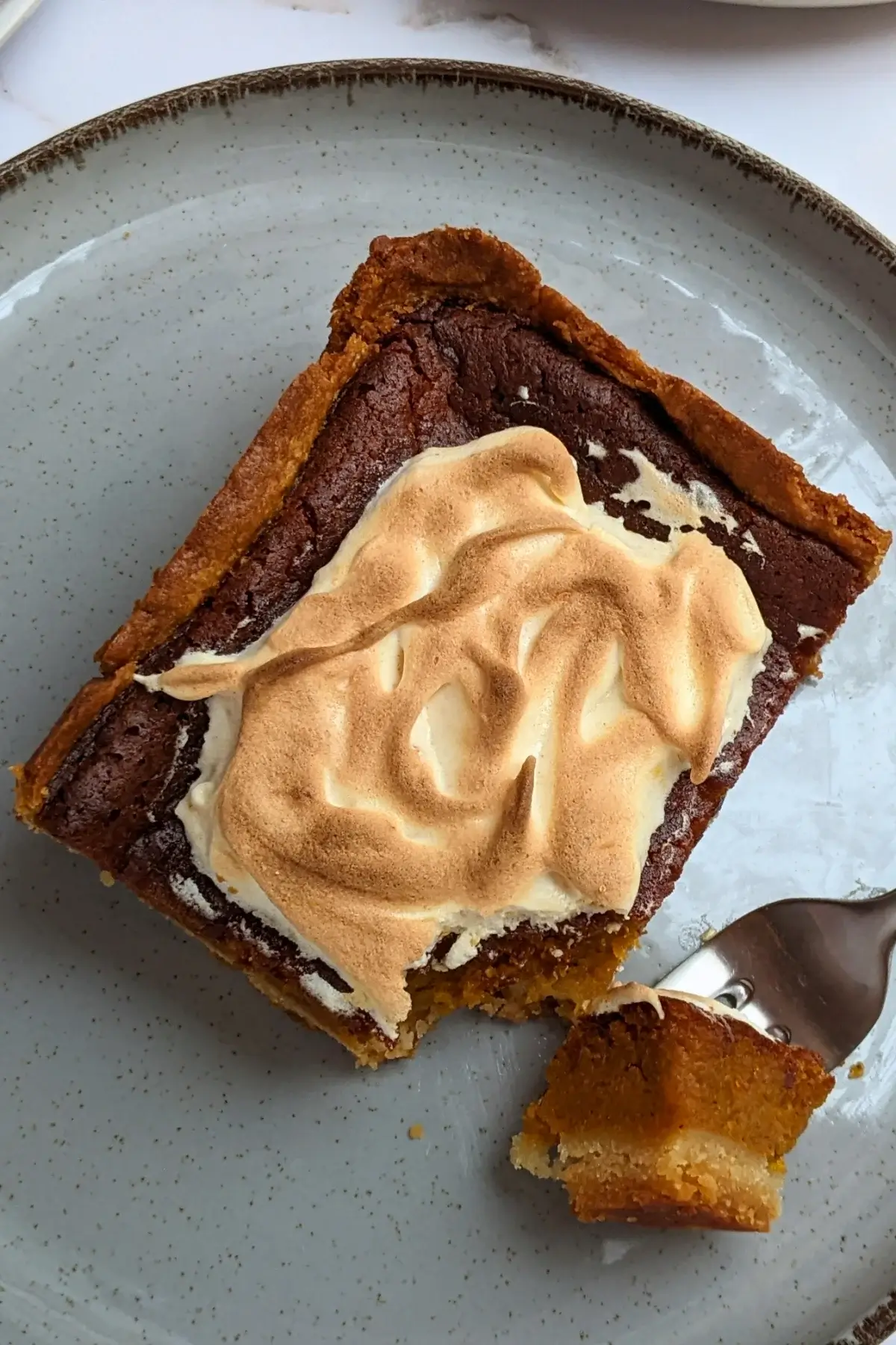Pumpkin Pie With Toasted Pumpkin Meringue Topping - classic pumpkin pie dessert made with a homemade pumpkin puree and heavy cream filling, full of autumn spices like cinnamon and pumpkin spice, and topped with a pumpkin French meringue.