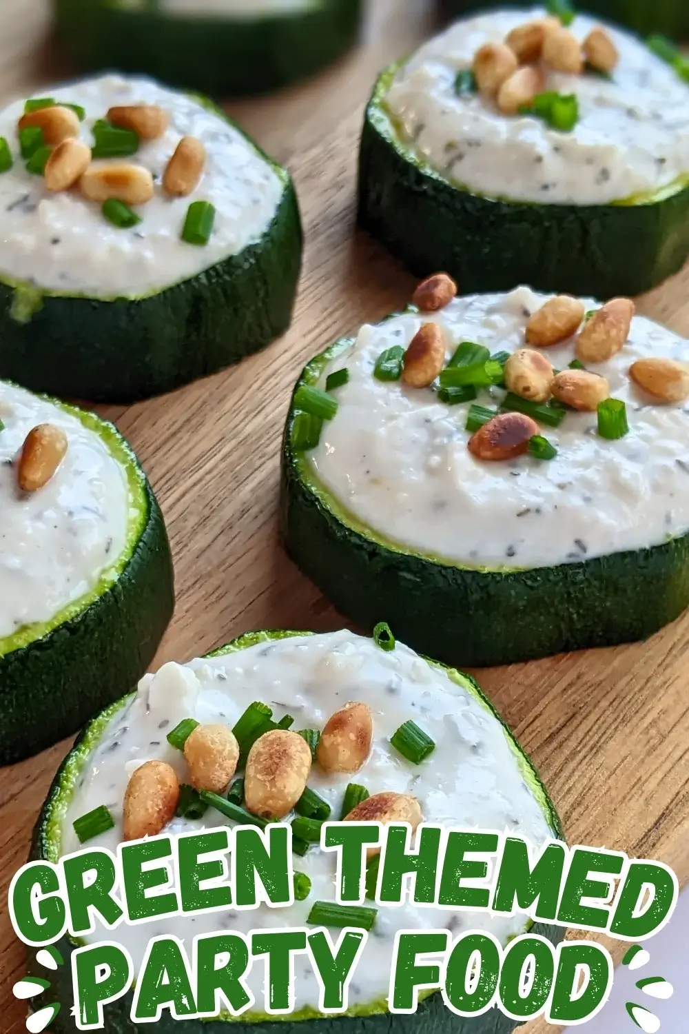 Baked Zucchini Rounds Appetizers With Goat Cheese - oven-baked zucchini rounds topped with a creamy goat cheese-Greek yogurt spread, toasted pine nuts, and fresh chives