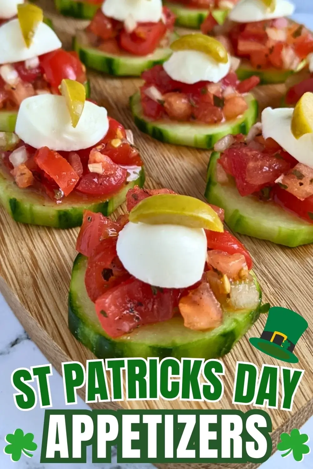 Fresh bruschetta cucumber bites appetizers topped with mozzarella balls and sliced olives, neatly arranged on a serving tray.