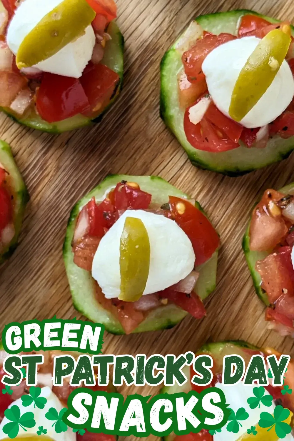 Bruschetta Cucumber Bites Appetizers - Fresh bruschetta cucumber bites appetizers topped with mozzarella balls and sliced olives, neatly arranged on a serving tray.