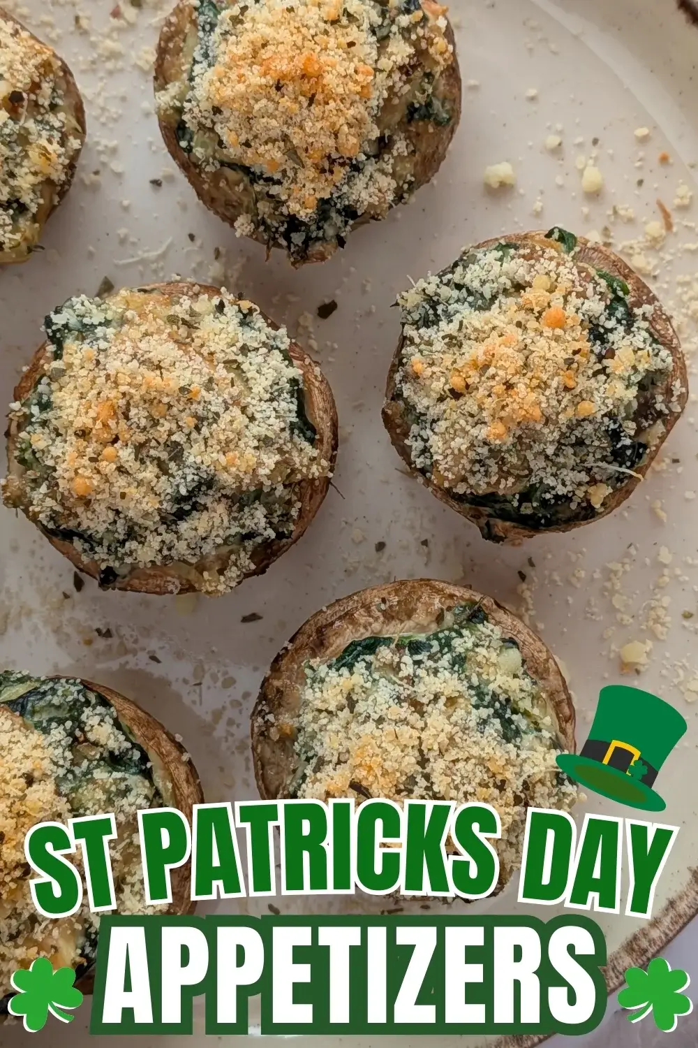 Chicken and Spinach Stuffed Mushrooms - oven-baked white button mushrooms filled with a creamy chicken, spinach, parmesan, and cream cheese filling, topped with dried breadcrumbs.