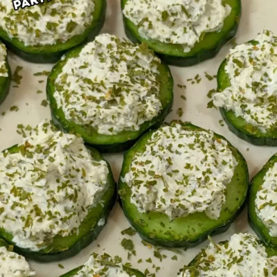 Cucumber Bites Appetizers With Herb and Garlic Cream Cheese - cucumber rounds topped with a homemade herb, garlic,and parmesan cream cheese mix.