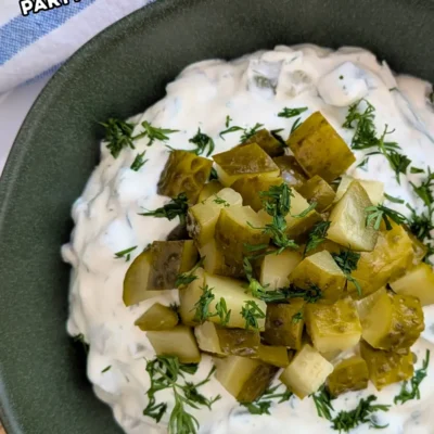 Dill Pickle Dip - creamy party dip made with sour cream, cream cheese, chopped dill pickles, fresh dill, and crushed garlic.