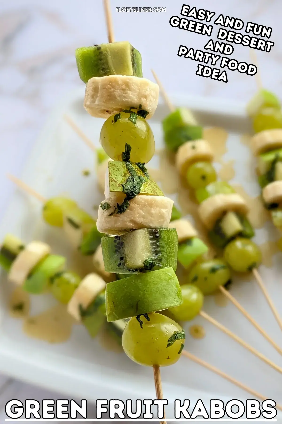 Green Fruit Kabobs - fruit skewers made with chunks of green fruits like kiwi, grapes, green apple, and green pear, plus chunks of bananas, drizzled with a fresh mint, lime juice, and maple sryup sauce.