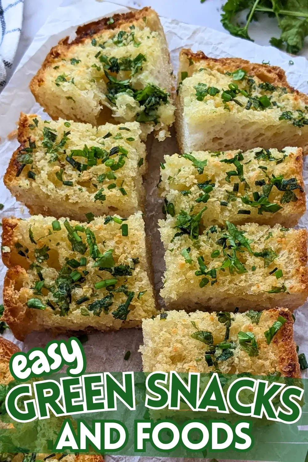 Homemade Garlic Bread - oven-toasted bread topped with creamy butter, fresh herbs like parsley and chives, and a ton of garlic.