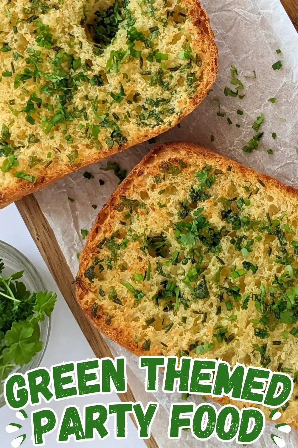 Homemade Garlic Bread - oven-toasted bread topped with creamy butter, fresh herbs like parsley and chives, and a ton of garlic.