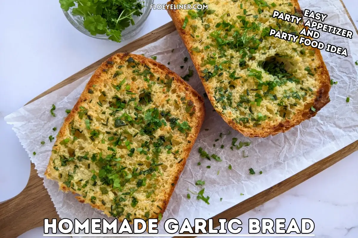 Homemade Garlic Bread - oven-toasted bread topped with creamy butter, fresh herbs like parsley and chives, and a ton of garlic.