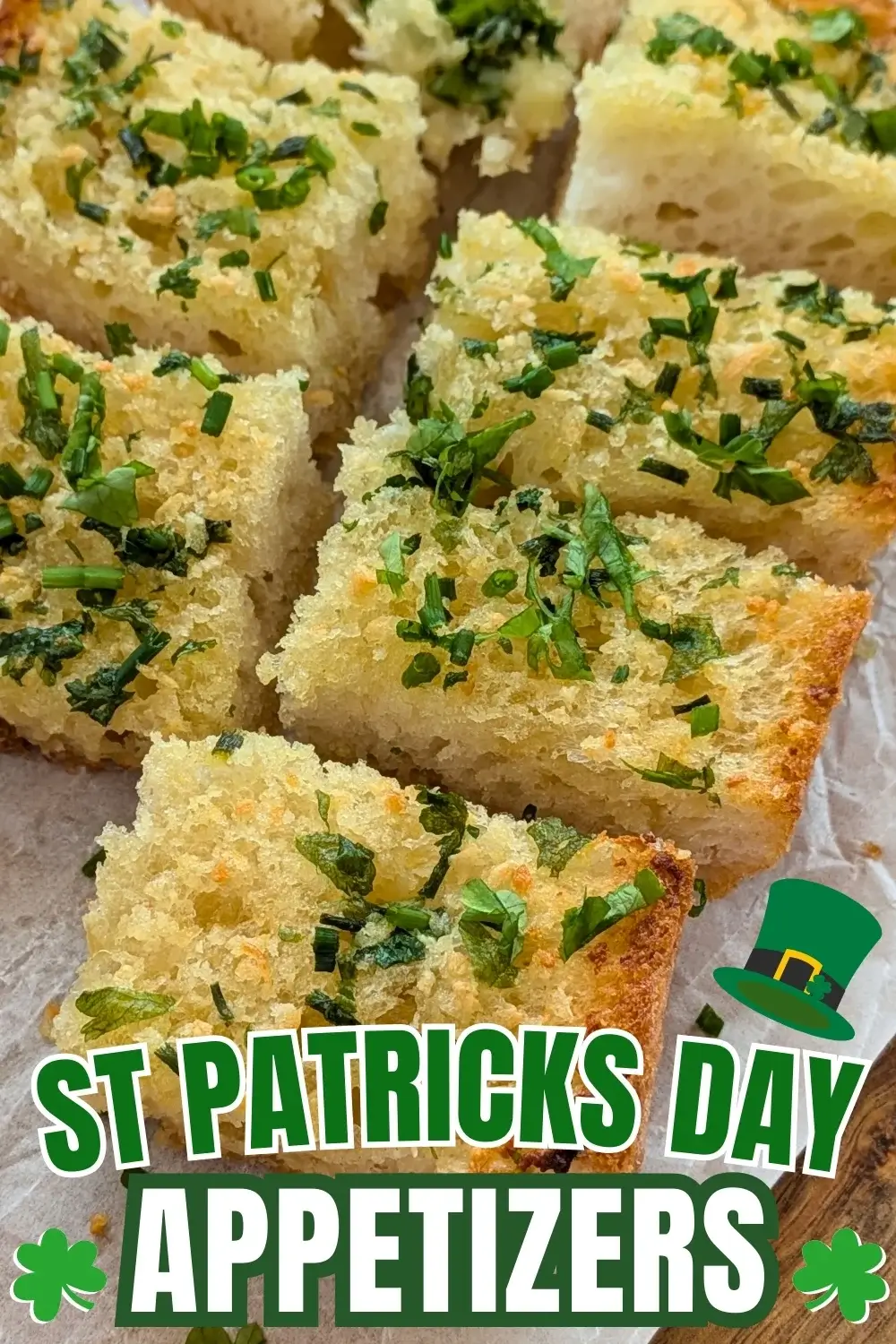 Homemade Garlic Bread - oven-toasted bread topped with creamy butter, fresh herbs like parsley and chives, and a ton of garlic.