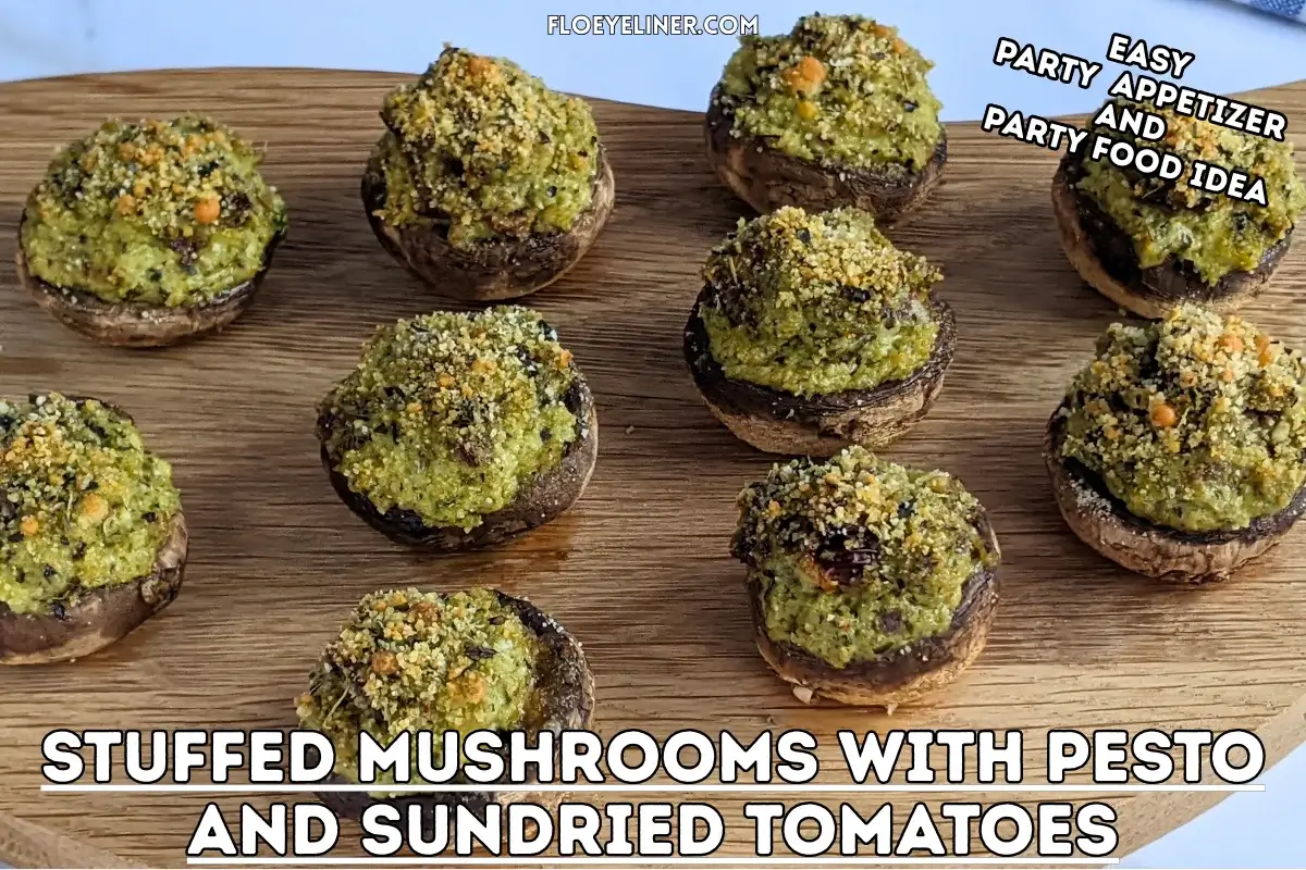 Italian-Style Stuffed Mushrooms With Pesto and Sundried Tomatoes - oven-baked white button mushrooms filled with a creamy ricotta, pesto, cream cheese, and sundried tomato filling topped with dried breadcrumbs.