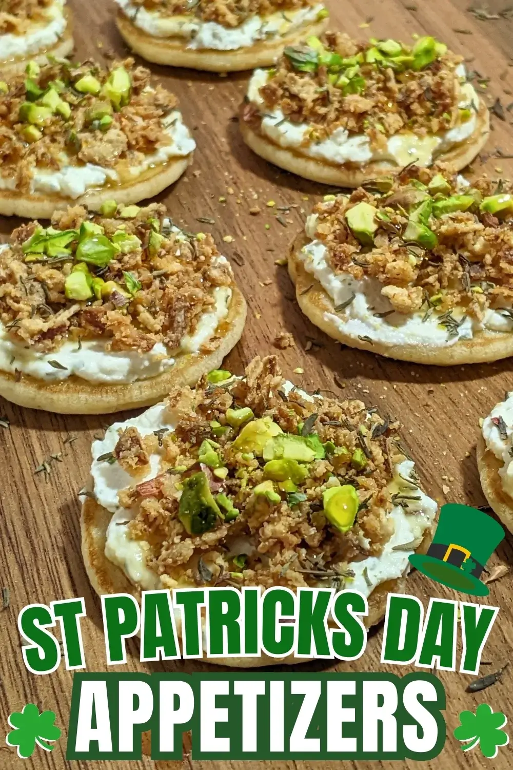 Mini Pancake Bites With Dried Onions - savory mini pancake canapes topped with a creamy herb-and-garlic cream cheese spread, crispy dried onions, maple syrup, and crushed pistachios for garnish.