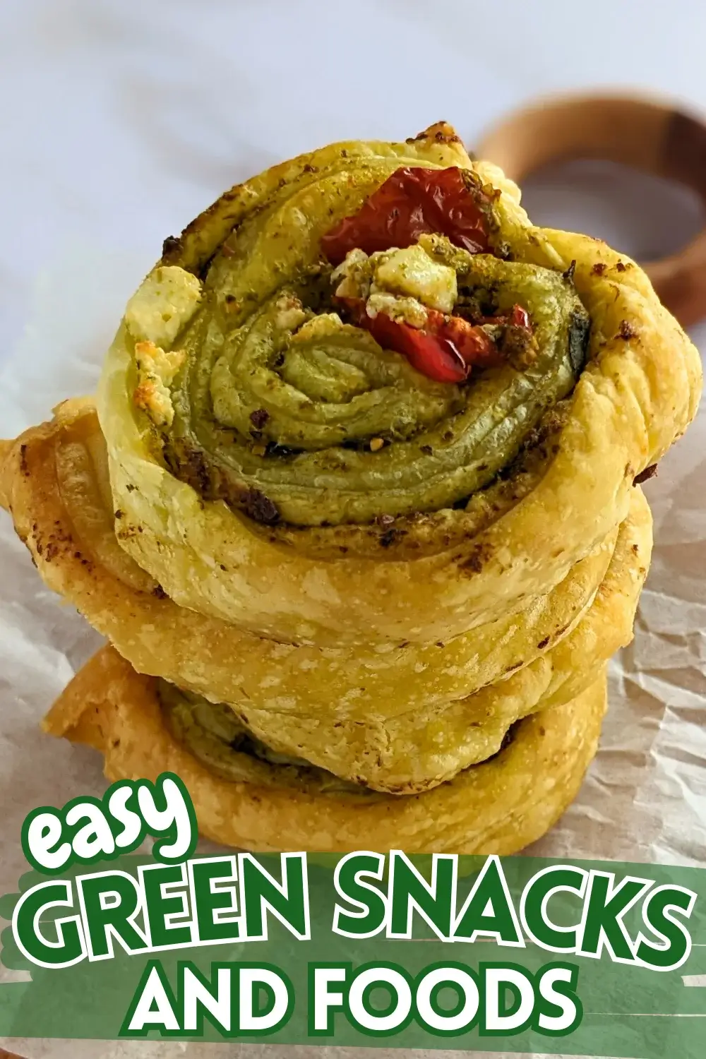 Pesto Pinwheels Appetizers - Savory pesto pinwheels appetizers made with puff pastry and filled with basil pesto, fresh cherry tomatoes, and crumbled feta.