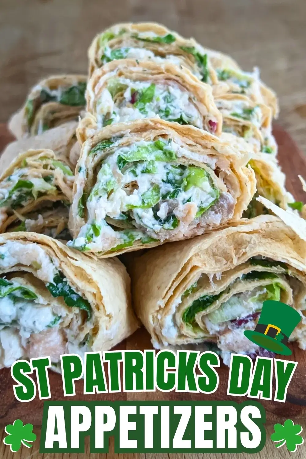 Smoked salmon flatbread appetizers sliced into pinwheels filled with salmon-cream cheese spread and fresh greens.