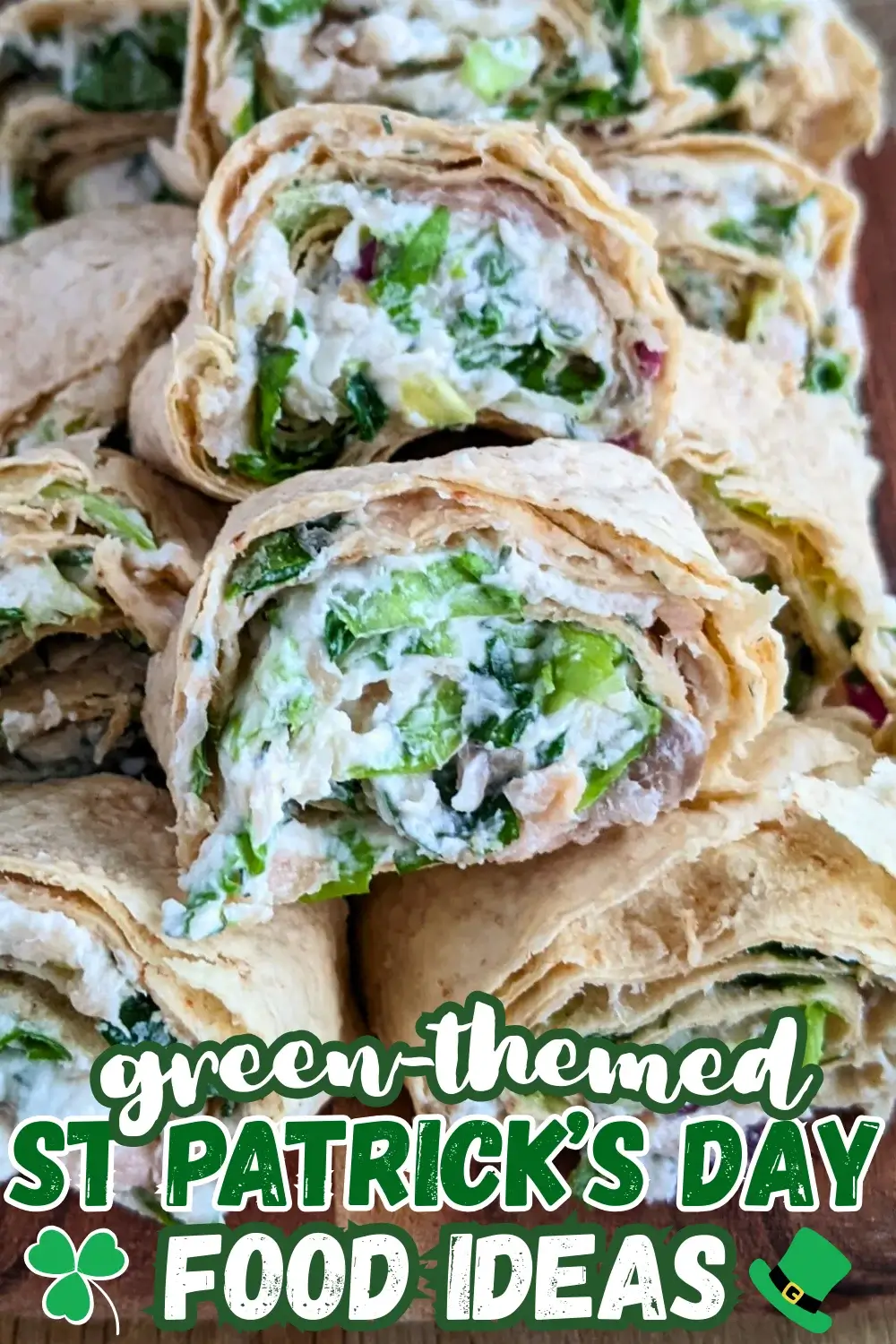 Smoked salmon flatbread appetizers sliced into pinwheels filled with salmon-cream cheese spread and fresh greens.