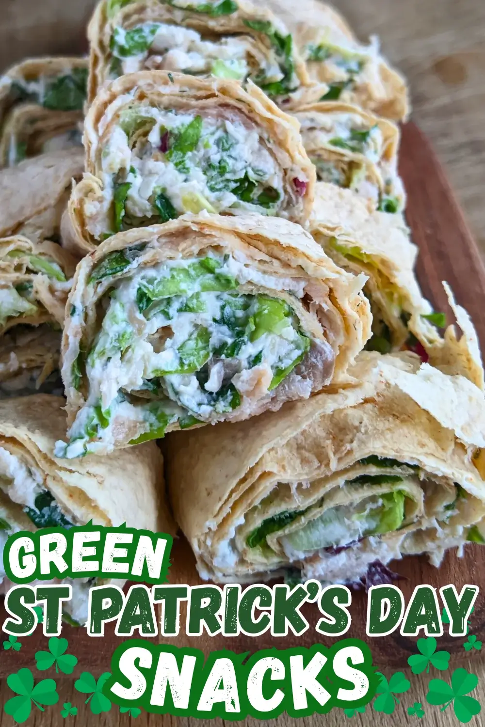 Smoked salmon flatbread appetizers sliced into pinwheels filled with salmon-cream cheese spread and fresh greens.