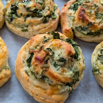 Spinach and Ricotta Rolls - appetizer rolls made with a savory homemade yeast dough and filled with a garlicky ricotta, parmesan, grated cheese, and fresh spinach mix.