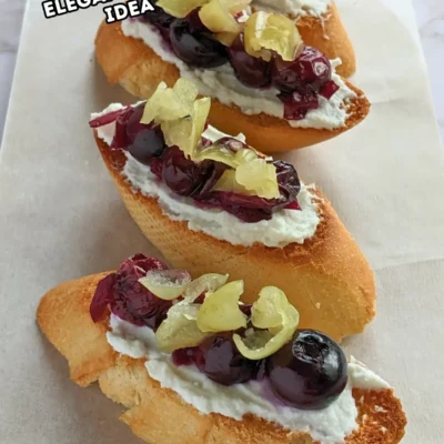 Blueberry Crostini Appetizers With Ricotta and Jalapeños - blueberry bruschetta appetizers made with toasted baguette slices, topped with creamy ricotta cheese, balsamic-stewed blueberries, and sliced jalapeños.