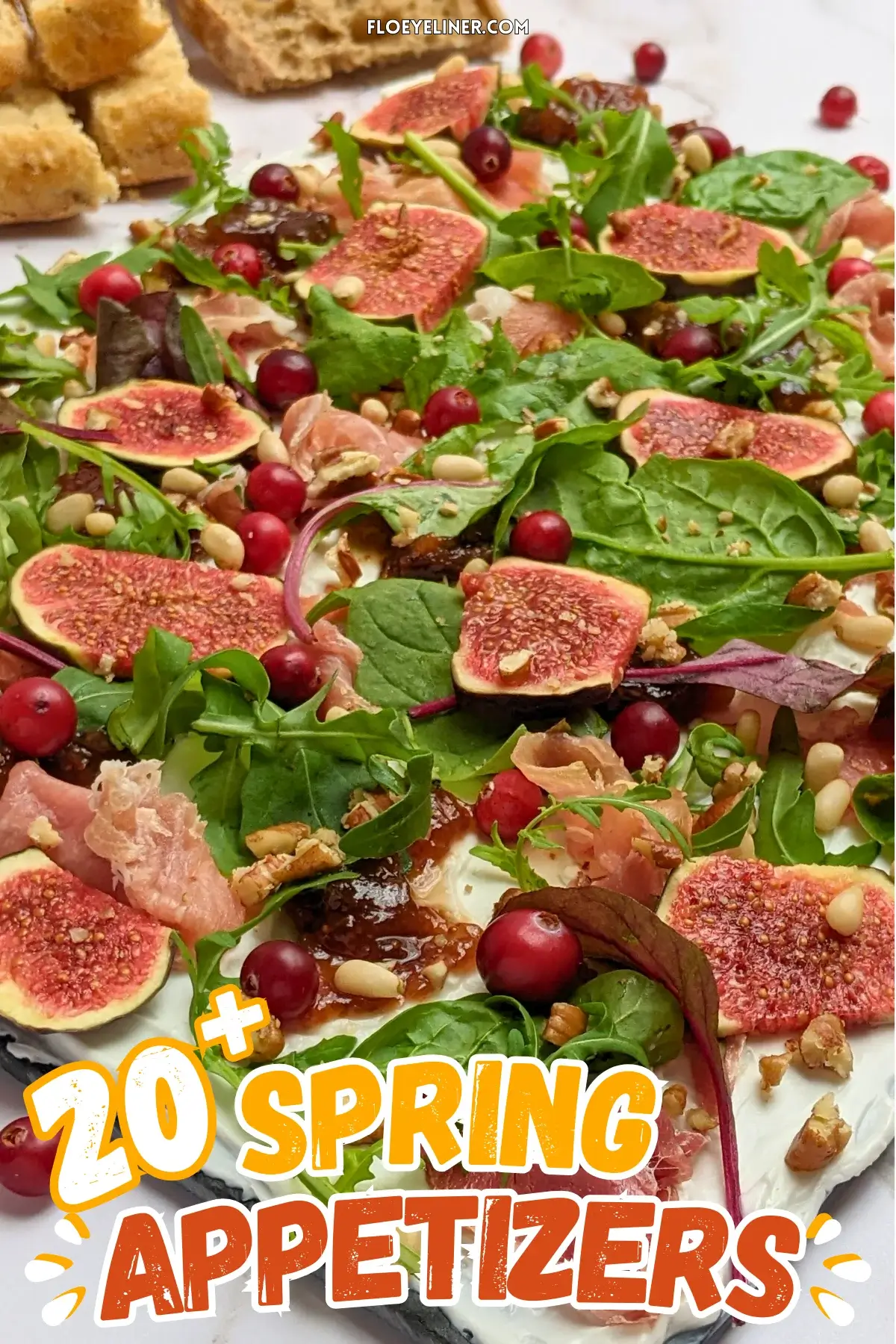 Fig and Goat Cheese Appetizer "Butter" Board With Prosciutto - appetizer board with fresh figs, fig jam, prosciutto, and crunchy toppings sprinkled over a whipped goat cheese spread on a party platter.