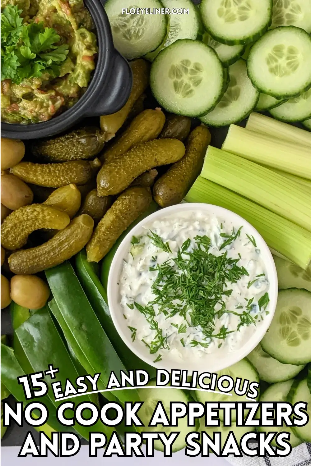 Green Veggie Tray - Green themed vegetable board with homemade guacamole and tzatziki sauce; fresh vegetables like cucumber, green bell peppers, celery, frillice lettuce, and avocado; and pickled foods like mini pickles, jalapenos, and olives in brine.