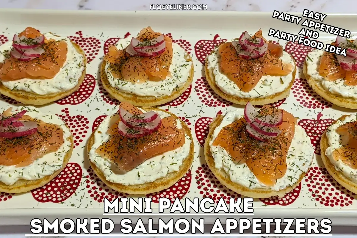 Mini Pancake Smoked Salmon Appetizers - savory mini pancake canapes topped with a creamy lemon-dill cream cheese spread, pieces of smoked salmon, and radish slices for garnish.