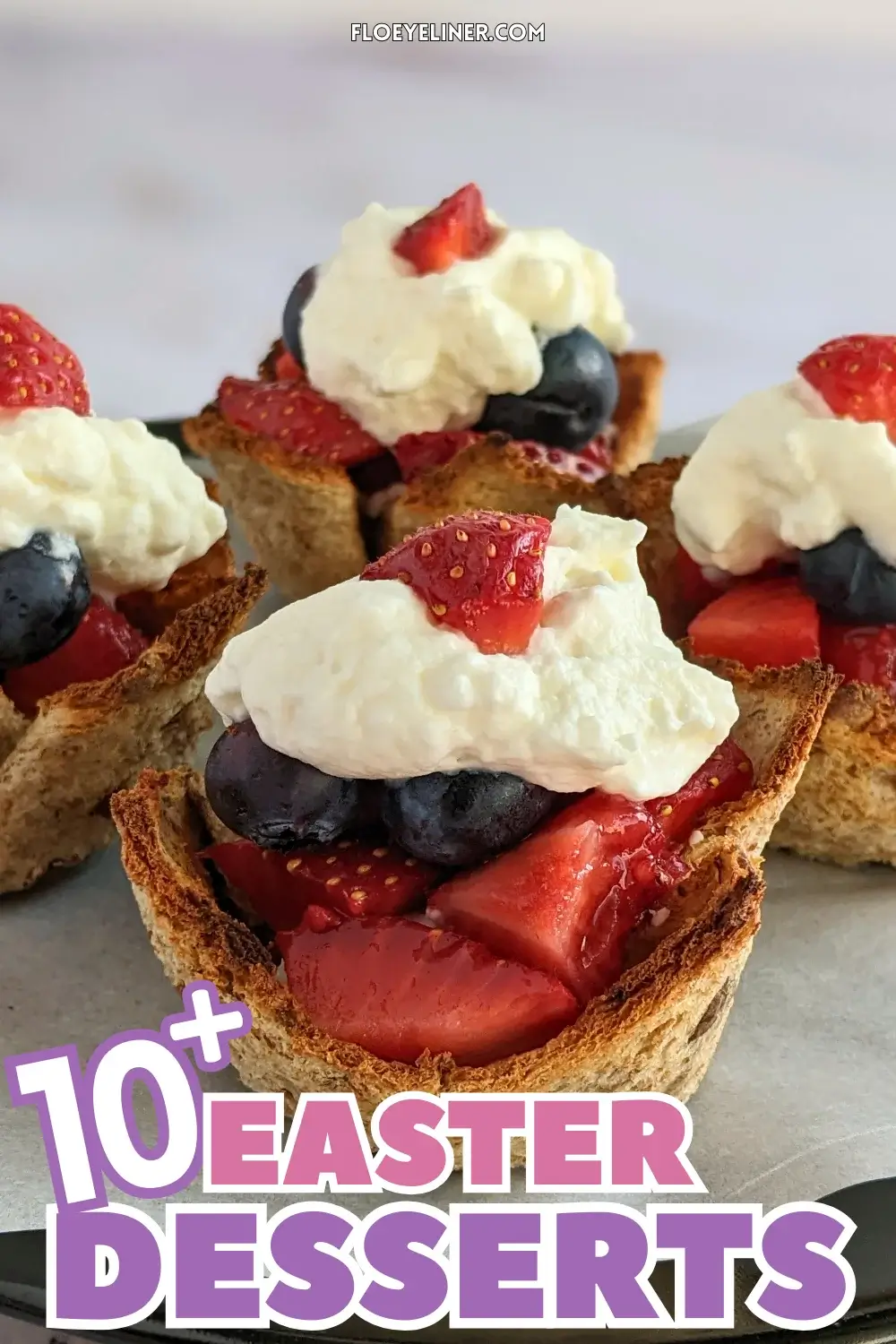 Mixed Berry Dessert Toast Cups With Whipped Cream - muffin-tin baked mini dessert cups made from white bread, filled with a spoon of sweet ricotta and mixed berries like strawberries and blueberries, topped with whipped cream.