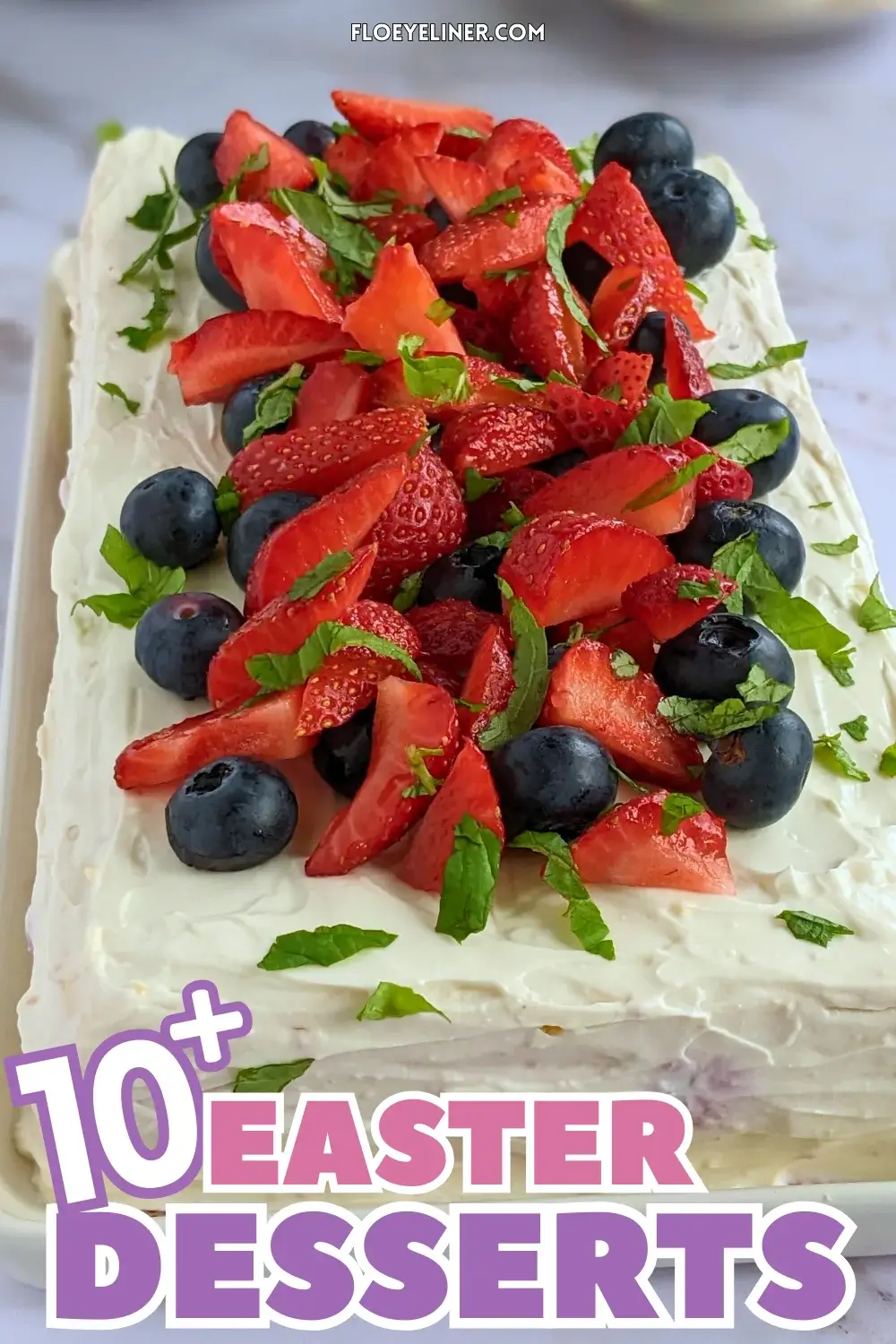 Mixed Berry Layer Cake With Mascarpone Greek Yogurt Frosting - triple-layer sponge cake with a blueberry-strawberry filling and mascarpone-Greek yogurt frosting, topped with fresh strawberries and blueberries.