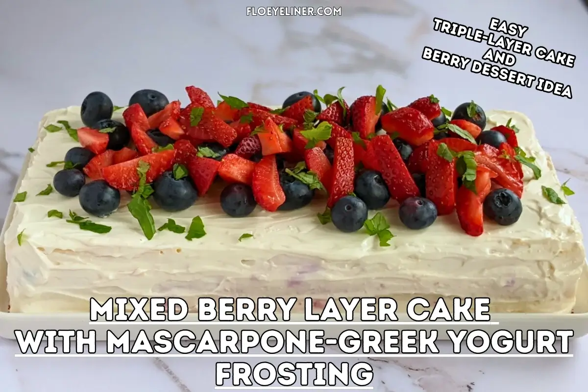 Mixed Berry Layer Cake With Mascarpone Greek Yogurt Frosting - triple-layer sponge cake with a blueberry-strawberry filling and mascarpone-Greek yogurt frosting, topped with fresh strawberries and blueberries.