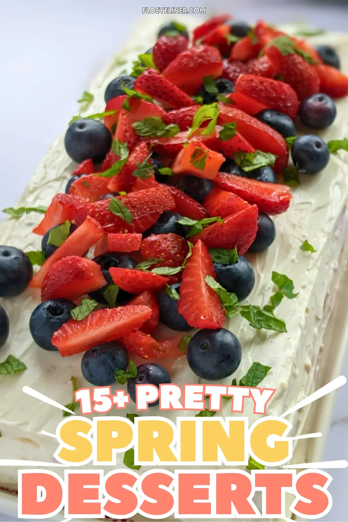 Mixed Berry Layer Cake With Mascarpone Greek Yogurt Frosting - triple-layer sponge cake with a blueberry-strawberry filling and mascarpone-Greek yogurt frosting, topped with fresh strawberries and blueberries.