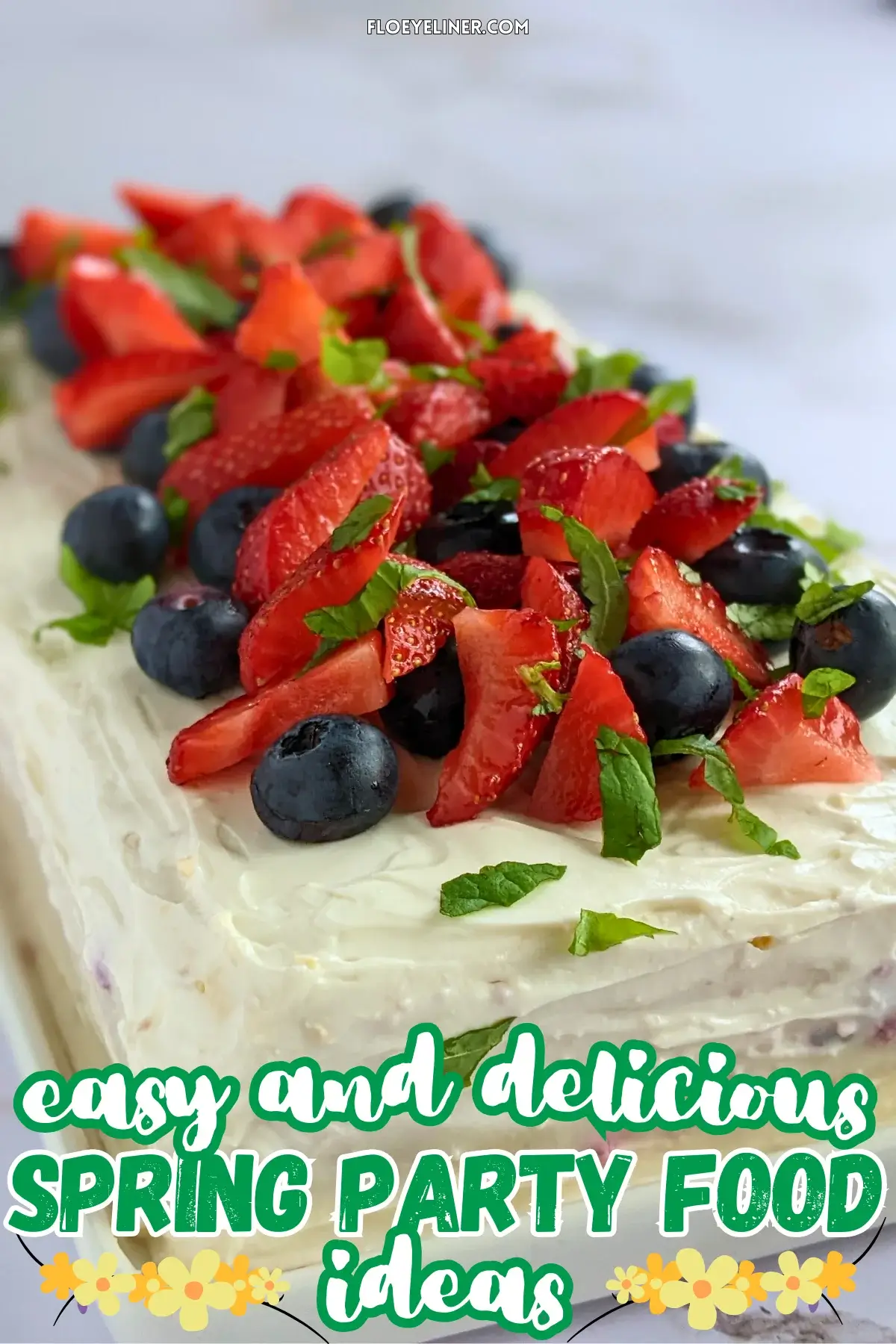 Mixed Berry Layer Cake With Mascarpone Greek Yogurt Frosting - triple-layer sponge cake with a blueberry-strawberry filling and mascarpone-Greek yogurt frosting, topped with fresh strawberries and blueberries.