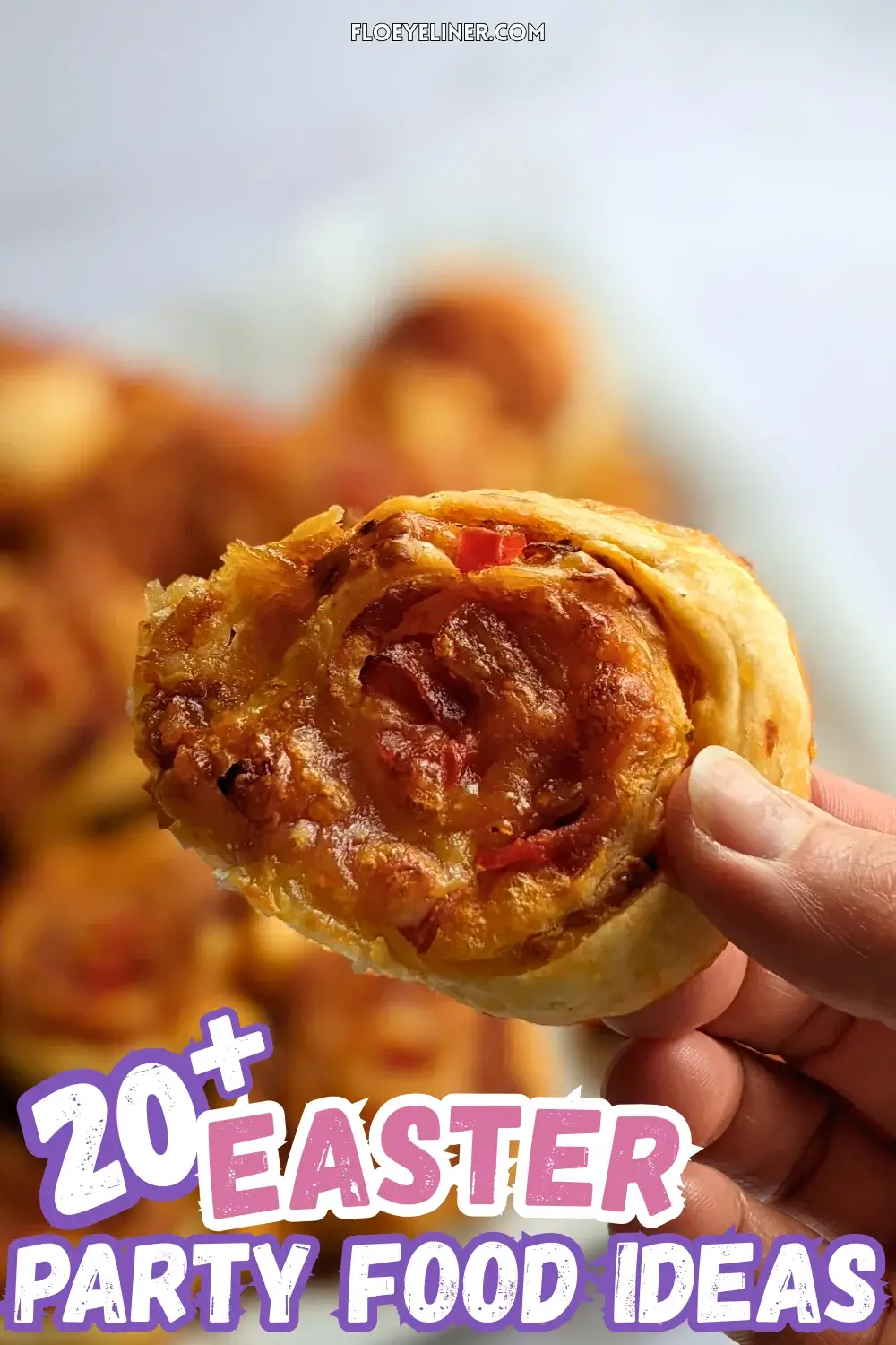 Pizza Pinwheels - Golden brown pizza pinwheels filled with tomato sauce, salami, and melted cheese.