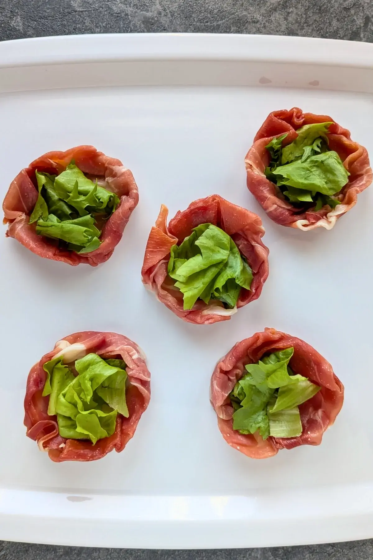 Prosciutto and Mini Mozzarella Bird Nests recipe process image.