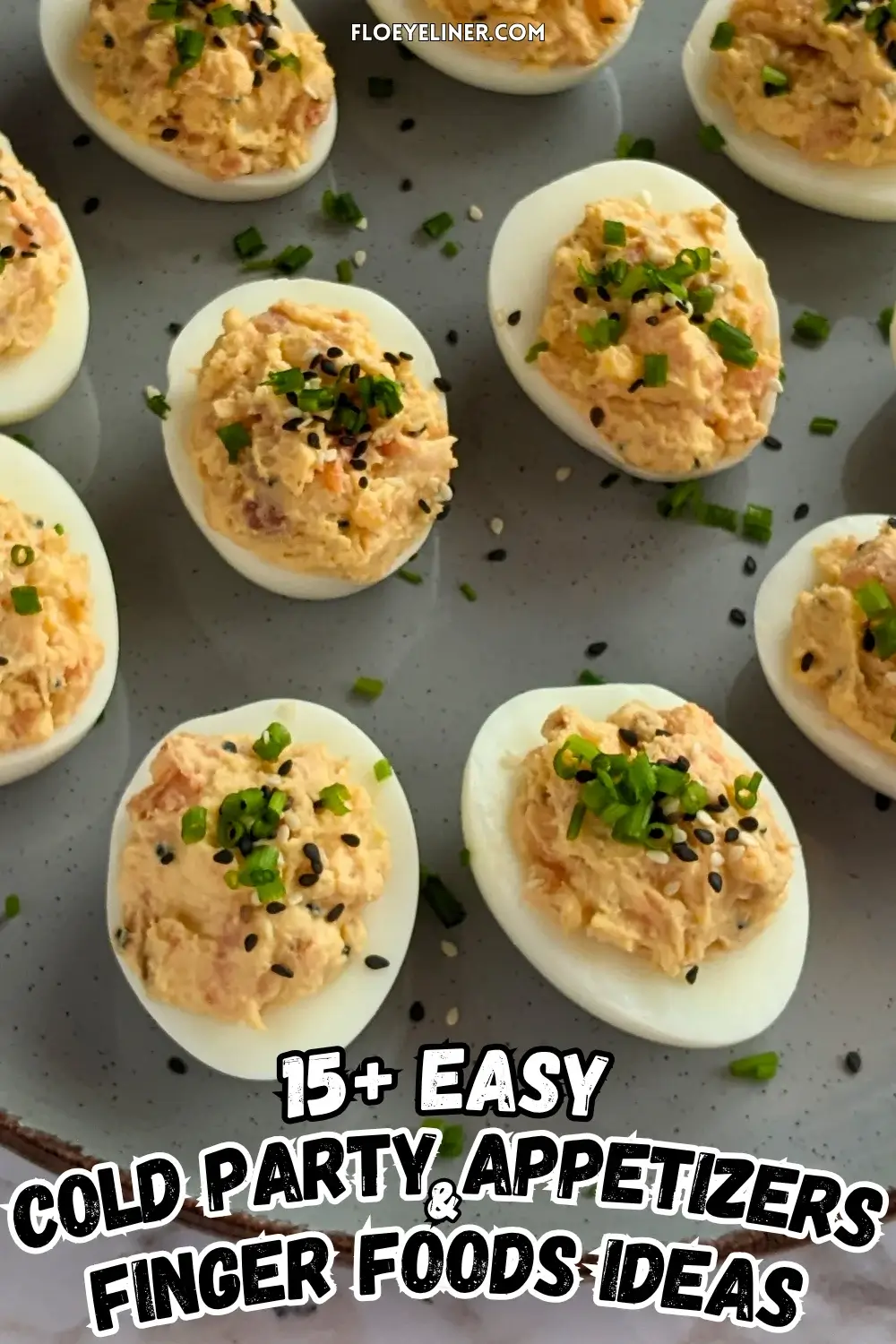 Smoked Salmon Deviled Eggs - deviled eggs filled with a creamy smoked salmon, cream cheese, sour cream, dijon mustard, and crispy dried chopped onions filling, topped with toasted sesame seeds and chopped chives.