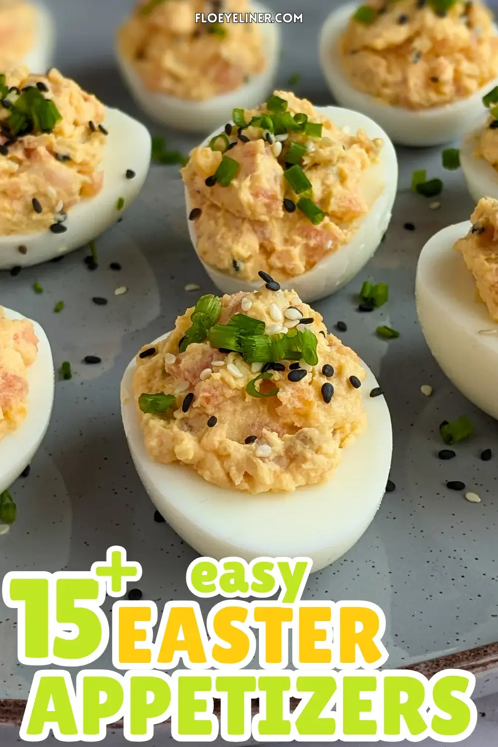 Smoked Salmon Deviled Eggs - deviled eggs filled with a creamy smoked salmon, cream cheese, sour cream, dijon mustard, and crispy dried chopped onions filling, topped with toasted sesame seeds and chopped chives.