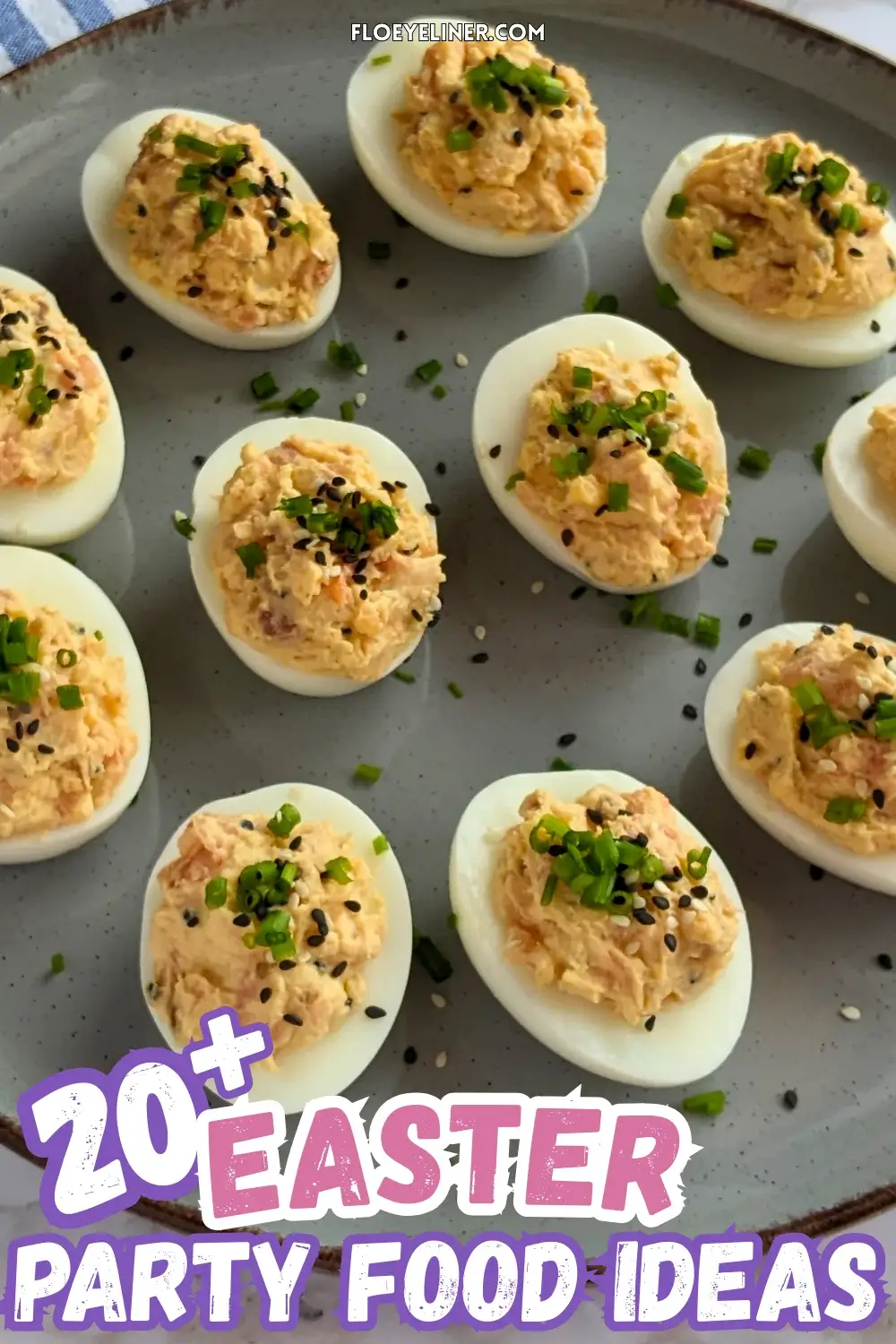 Smoked Salmon Deviled Eggs - deviled eggs filled with a creamy smoked salmon, cream cheese, sour cream, dijon mustard, and crispy dried chopped onions filling, topped with toasted sesame seeds and chopped chives.