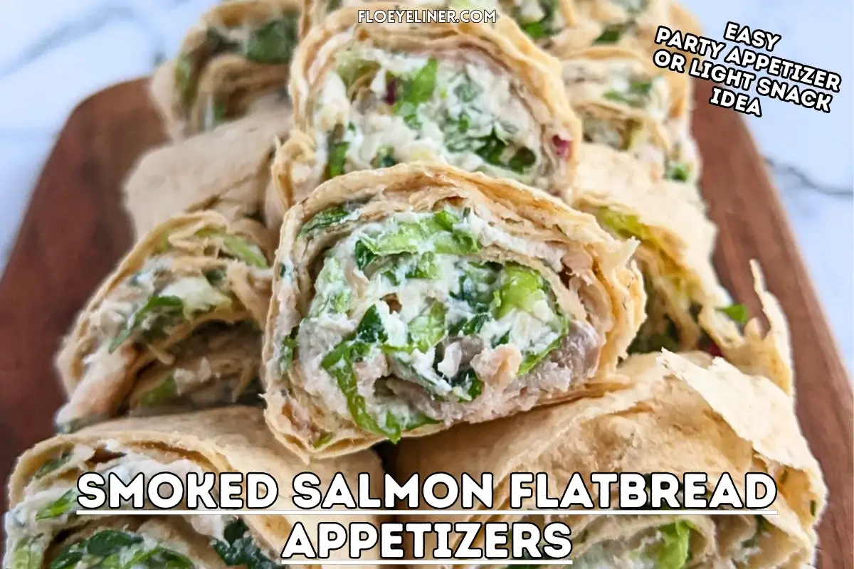 Smoked salmon flatbread appetizers sliced into pinwheels filled with salmon-cream cheese spread and fresh greens.
