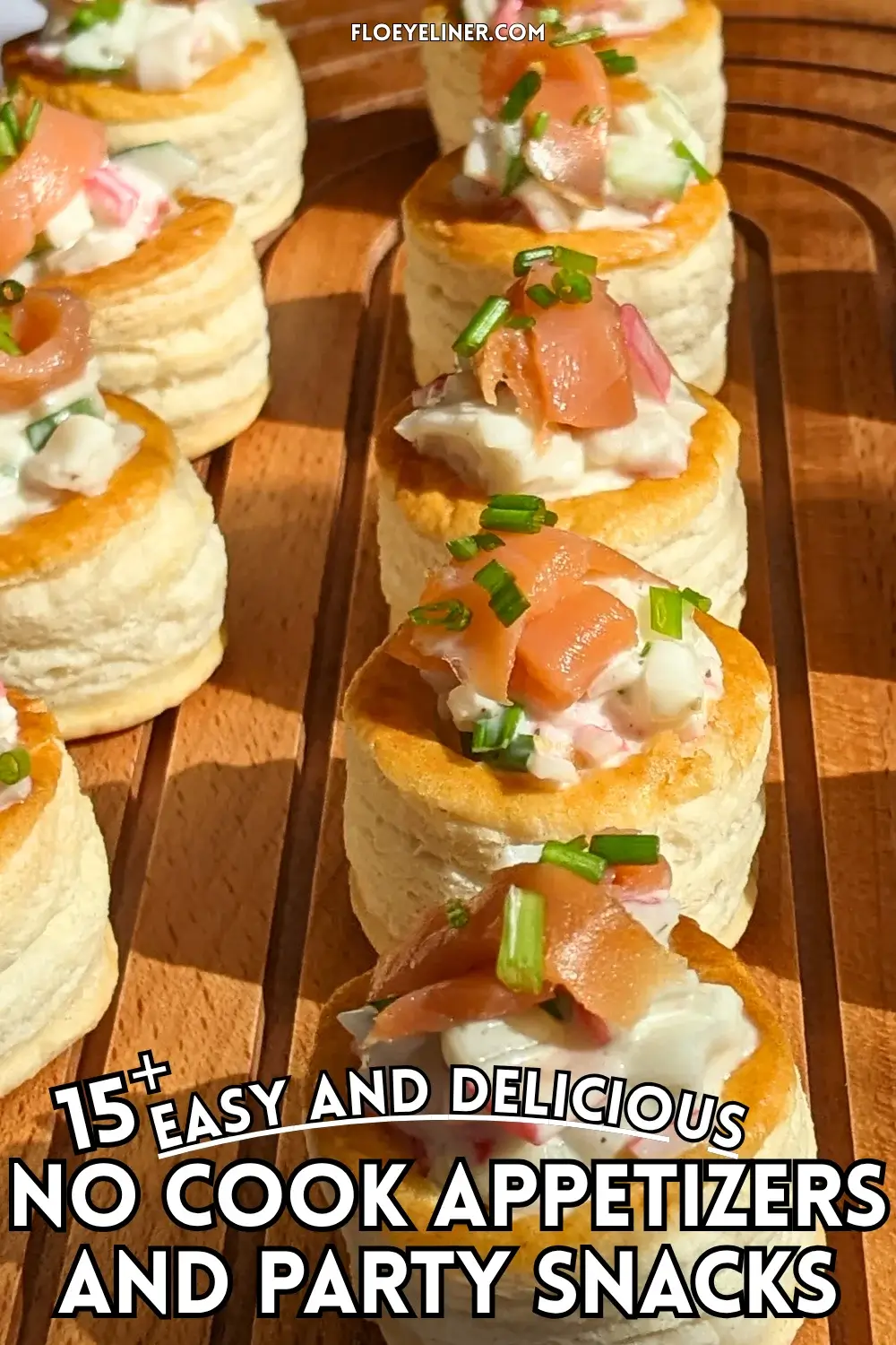 Surimi vol au vent appetizers - puff pastry vol au vent shells filled with a surimi, cucumber, and mayonnaise salad topped with smoked salmon and fresh chives.