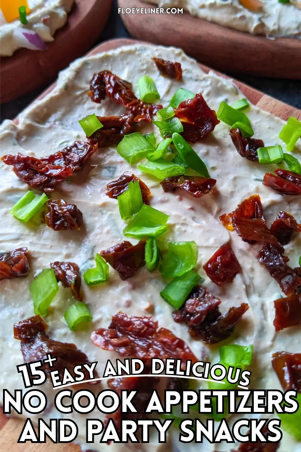 Trio of whipped feta board appetizers, one topped with smoked salmon and fresh chives, the other with sun-dried tomatoes and fresh green onions, and the third with yellow bell peppers, red onion, and fresh chives, all on a creamy feta dip base.