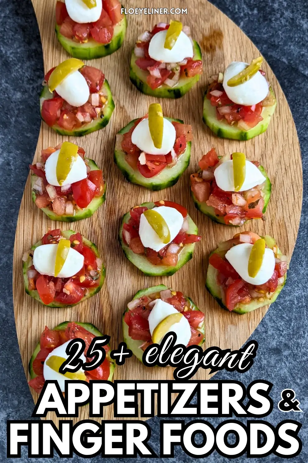 Bruschetta Cucumber Bites Appetizers - Fresh bruschetta cucumber bites appetizers topped with mozzarella balls and sliced olives, neatly arranged on a serving tray.