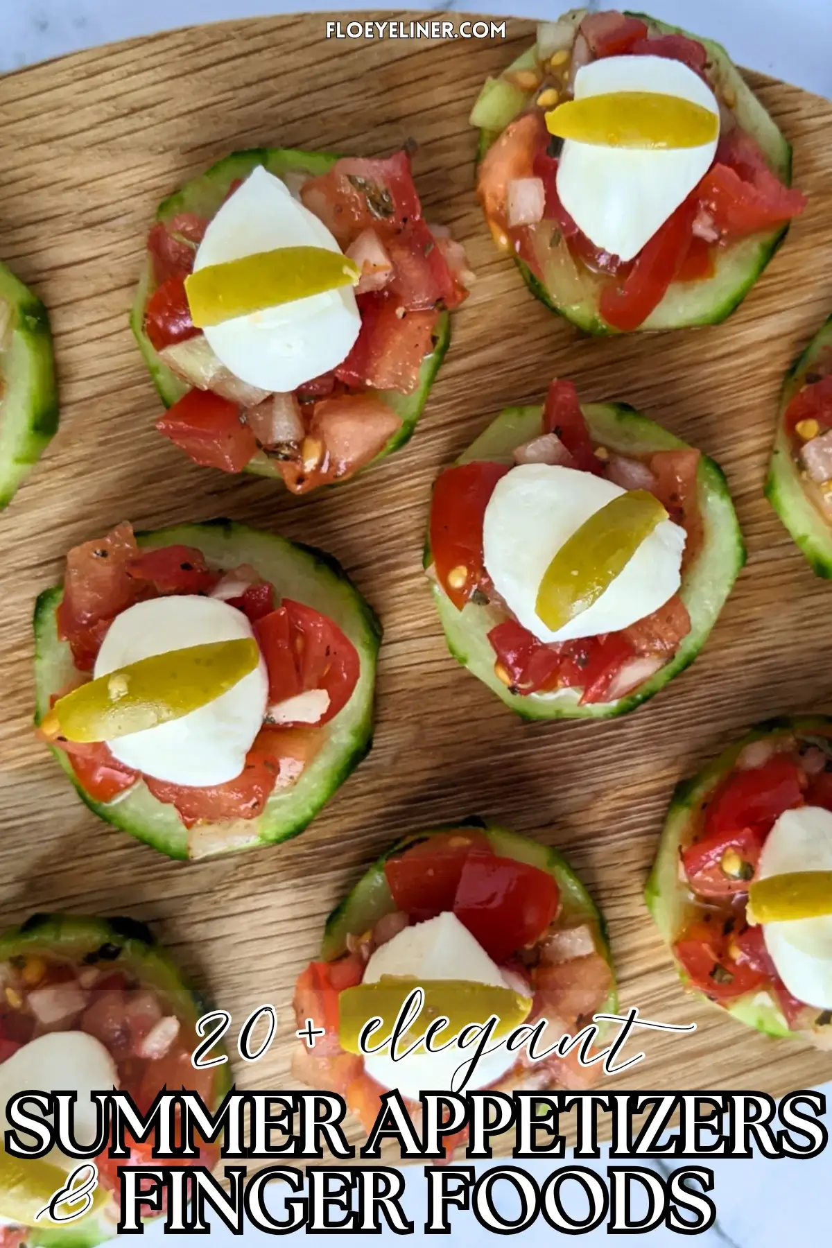 Bruschetta Cucumber Bites Appetizers - Fresh bruschetta cucumber bites appetizers topped with mozzarella balls and sliced olives, neatly arranged on a serving tray.