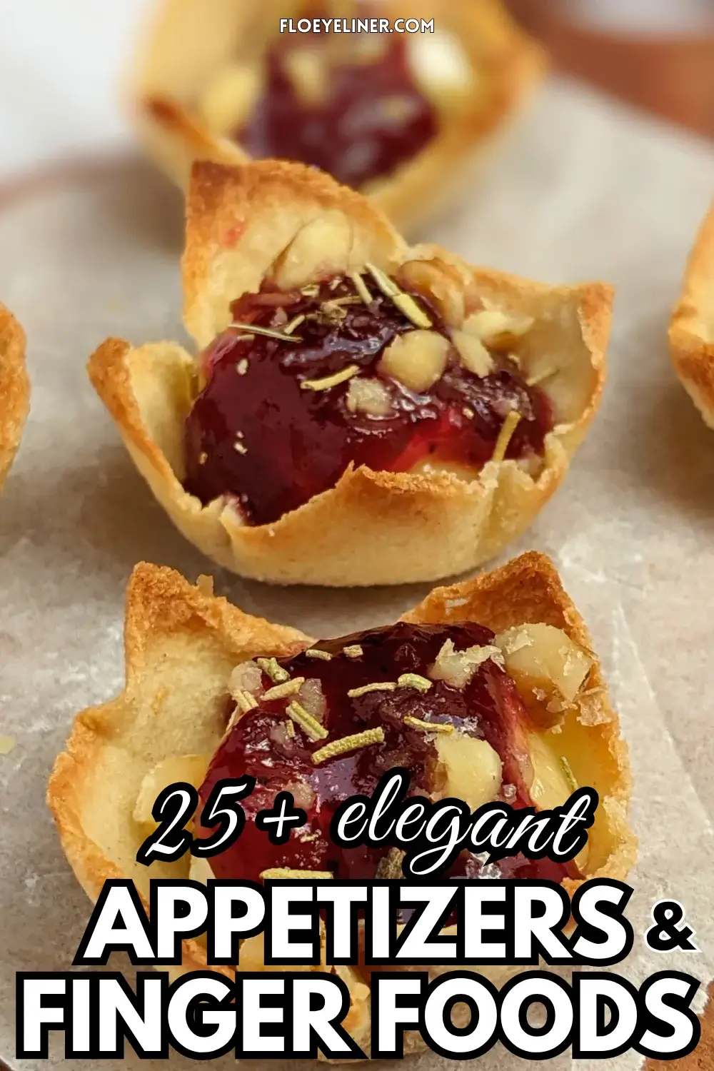 Cranberry brie bites - mini toast cup appetizers filled with brie cheese, topped with cranberry jam and crushed walnuts