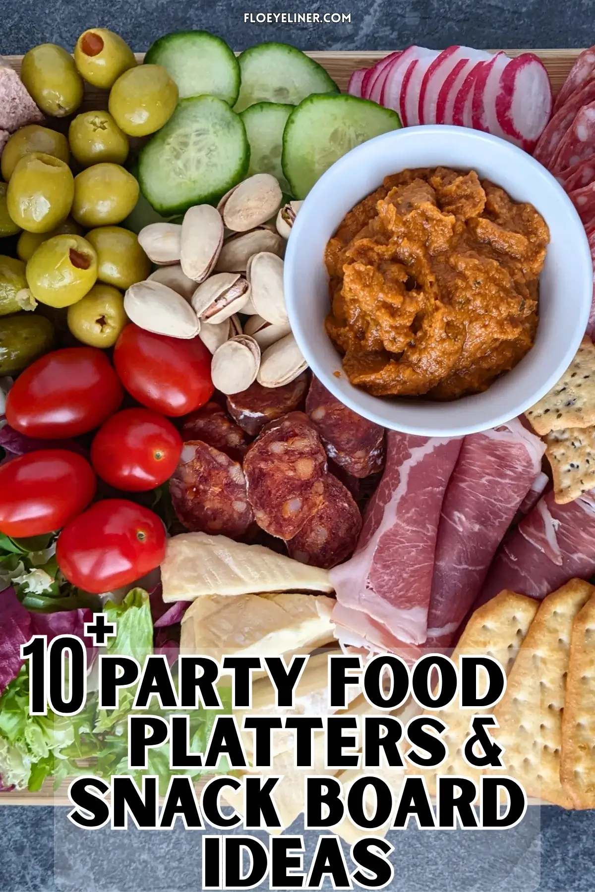 Healthier Charcuterie Appetizer Board - A healthier charcuterie appetizer board featuring fresh vegetables, soft cheeses, sliced meats, and pickled bites on a rustic board.