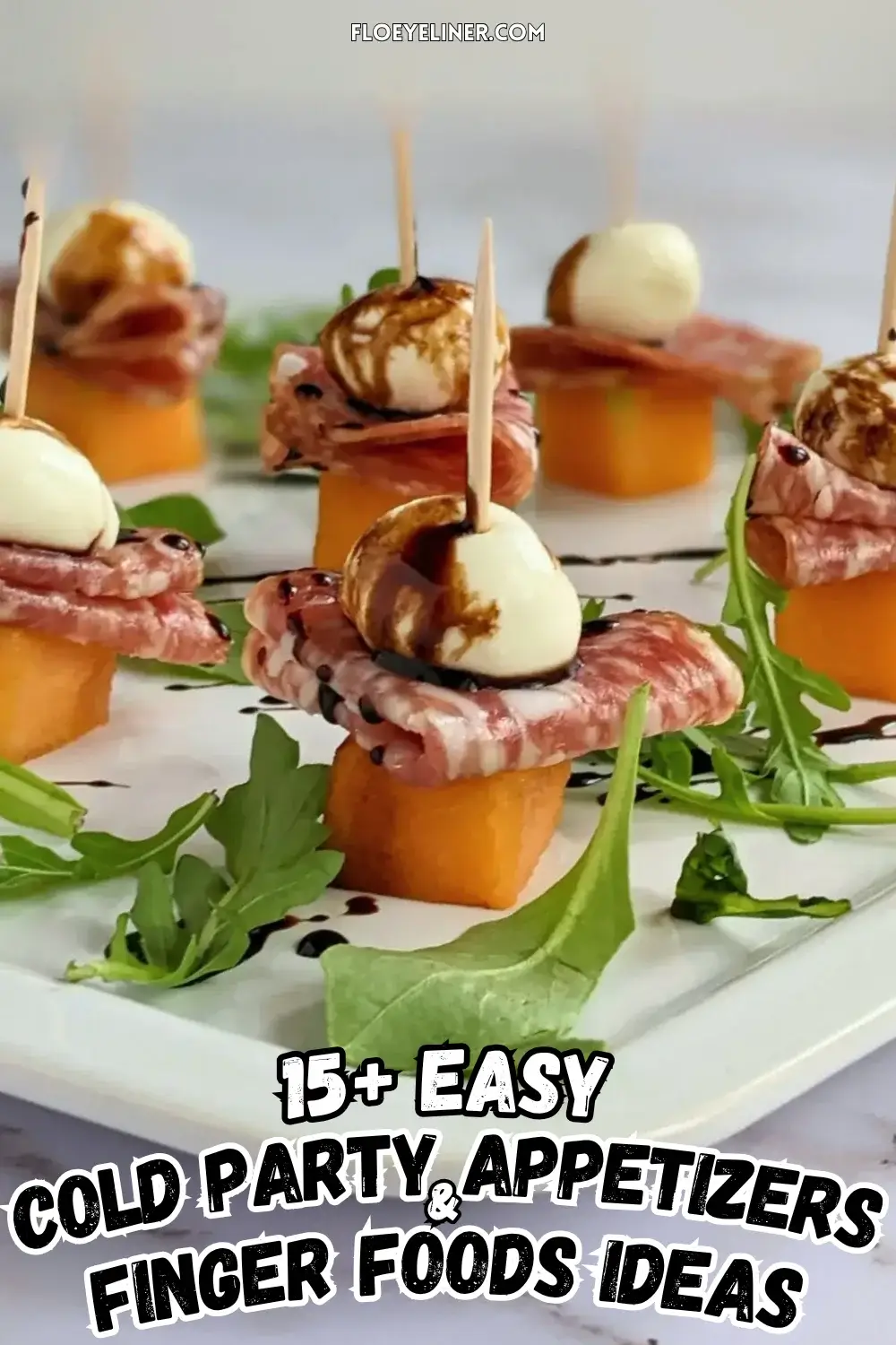 Melon and Salami Toothpick Appetizers With Mozzarella - easy fruit and cheese skewers made with melon, dried salami, and mini mozzarella balls served on a bed of arugula and topped with a balsamic glaze.