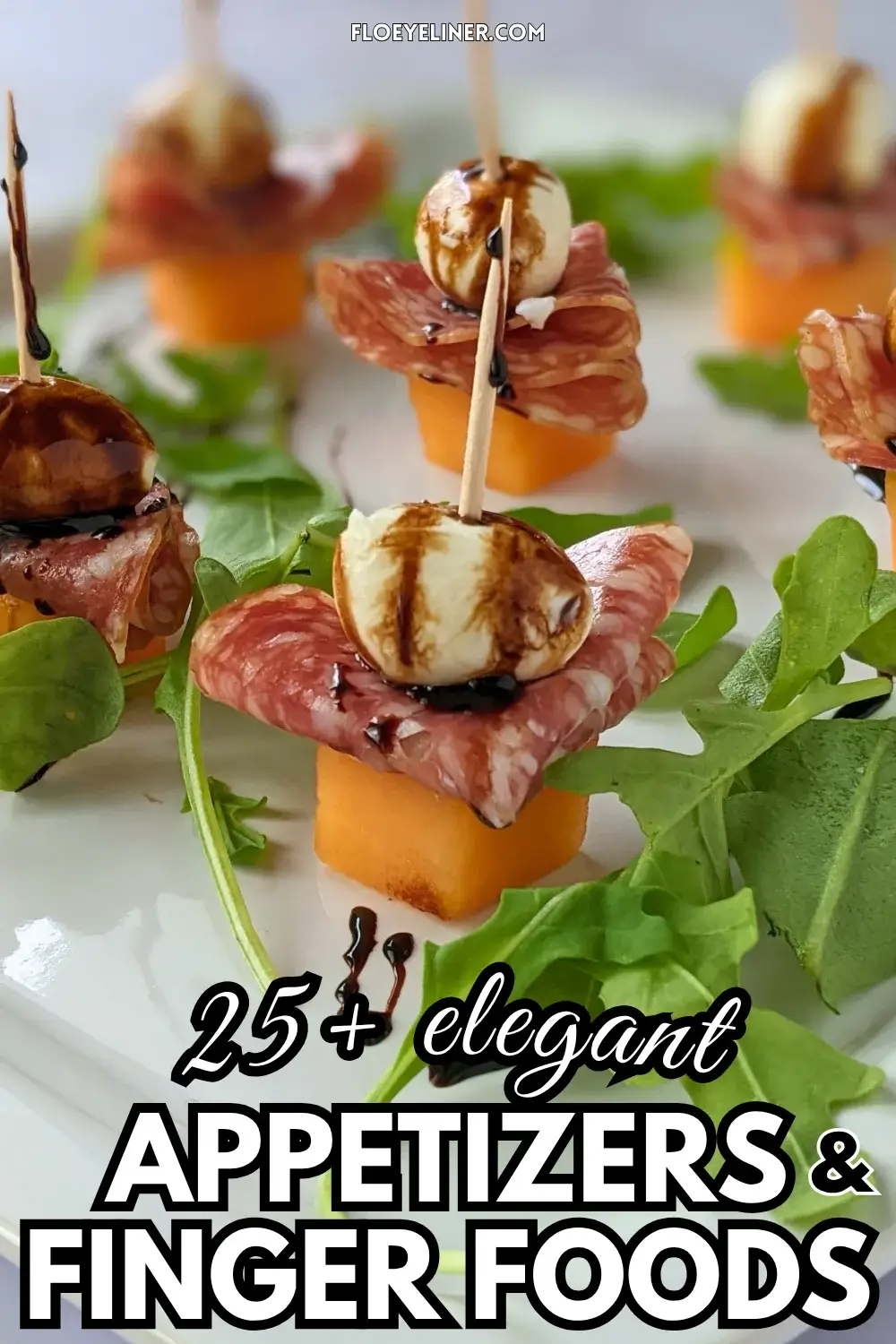 Melon and Salami Toothpick Appetizers With Mozzarella - easy fruit and cheese skewers made with melon, dried salami, and mini mozzarella balls served on a bed of arugula and topped with a balsamic glaze.