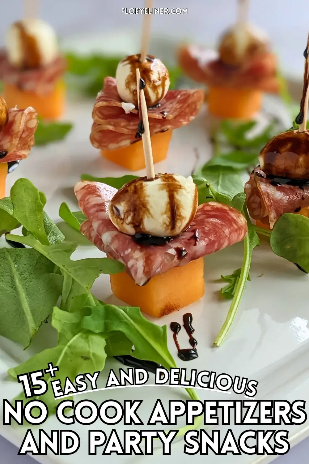Melon and Salami Toothpick Appetizers With Mozzarella - easy fruit and cheese skewers made with melon, dried salami, and mini mozzarella balls served on a bed of arugula and topped with a balsamic glaze.