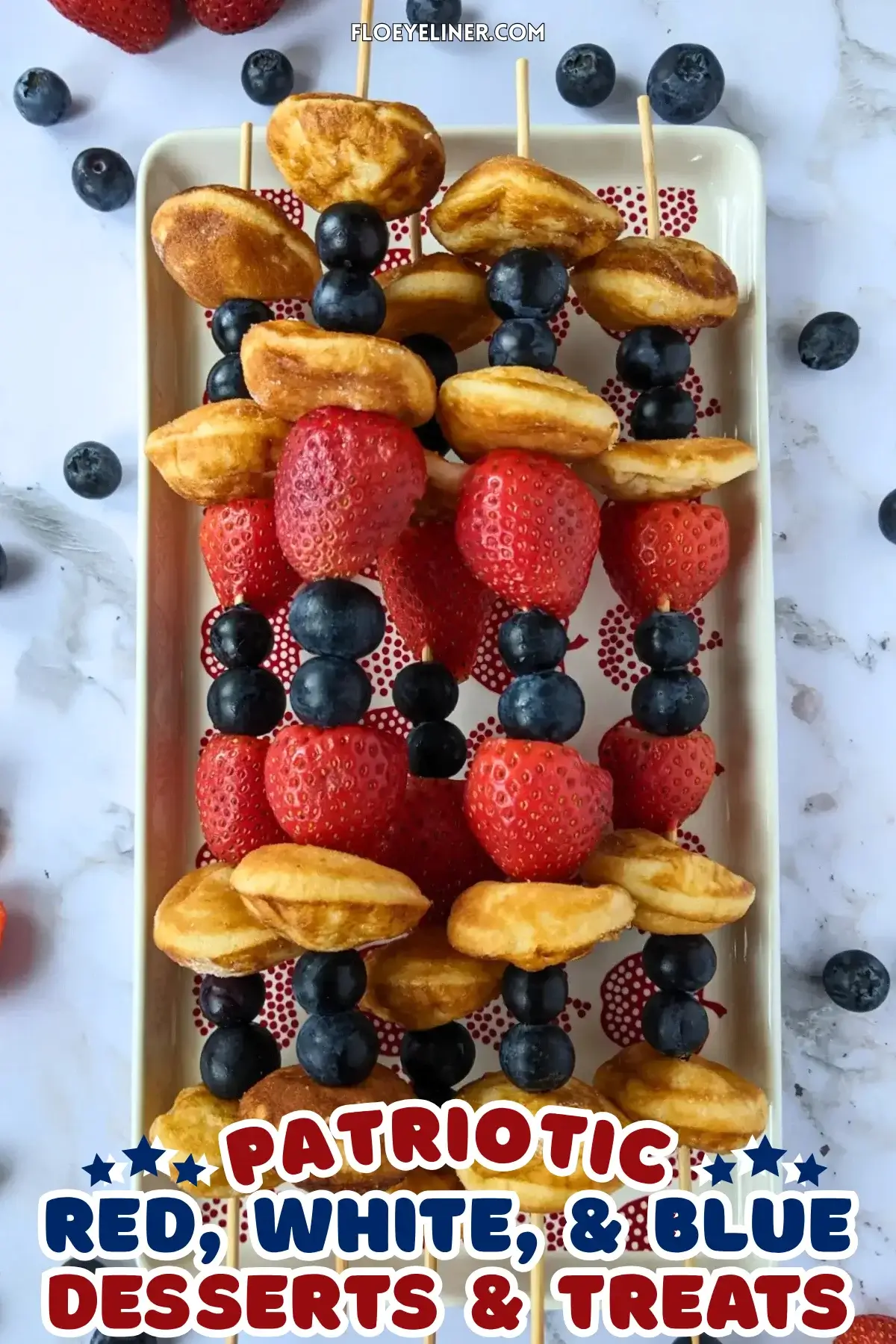 Mini Pancake Skewers With Fresh Berries - dessert skewers on toothpicks made with alternating layers of mini pancakes and fresh strawberries and blueberries. 