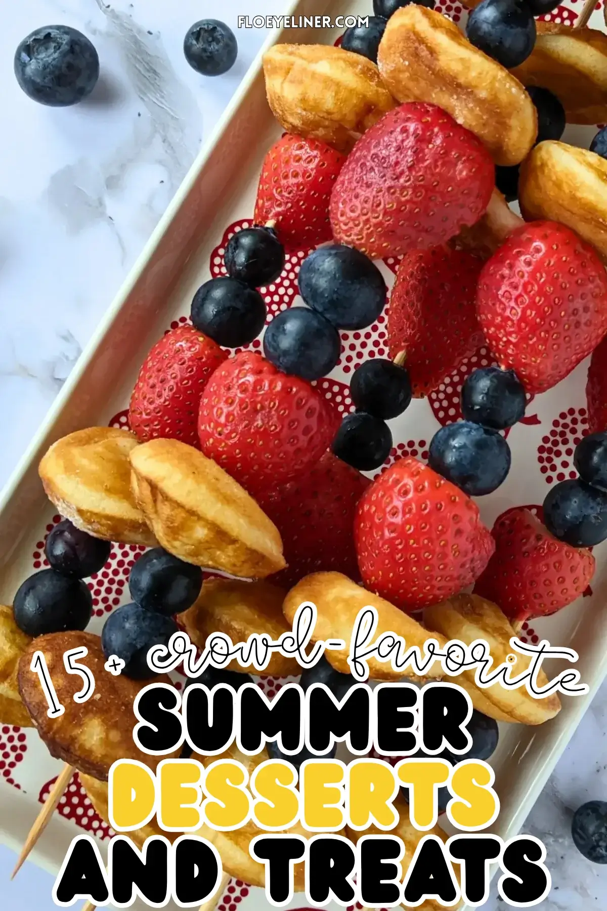 Mini Pancake Skewers With Fresh Berries - dessert skewers on toothpicks made with alternating layers of mini pancakes and fresh strawberries and blueberries.