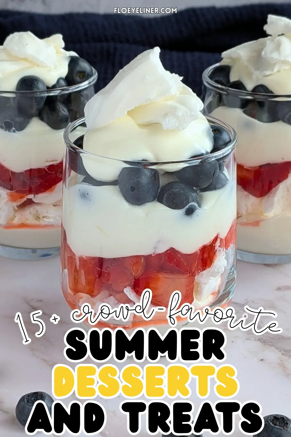 Mixed Berry Eton Mess Desserts - individual eton mess dessert cups, made with layers of mascarpone-whipped cream mix, crushed meringue, fresh strawberries, another layer of mascarpone-whipped cream mix, fresh blueberries, and topped with more cream and crushed meringue.