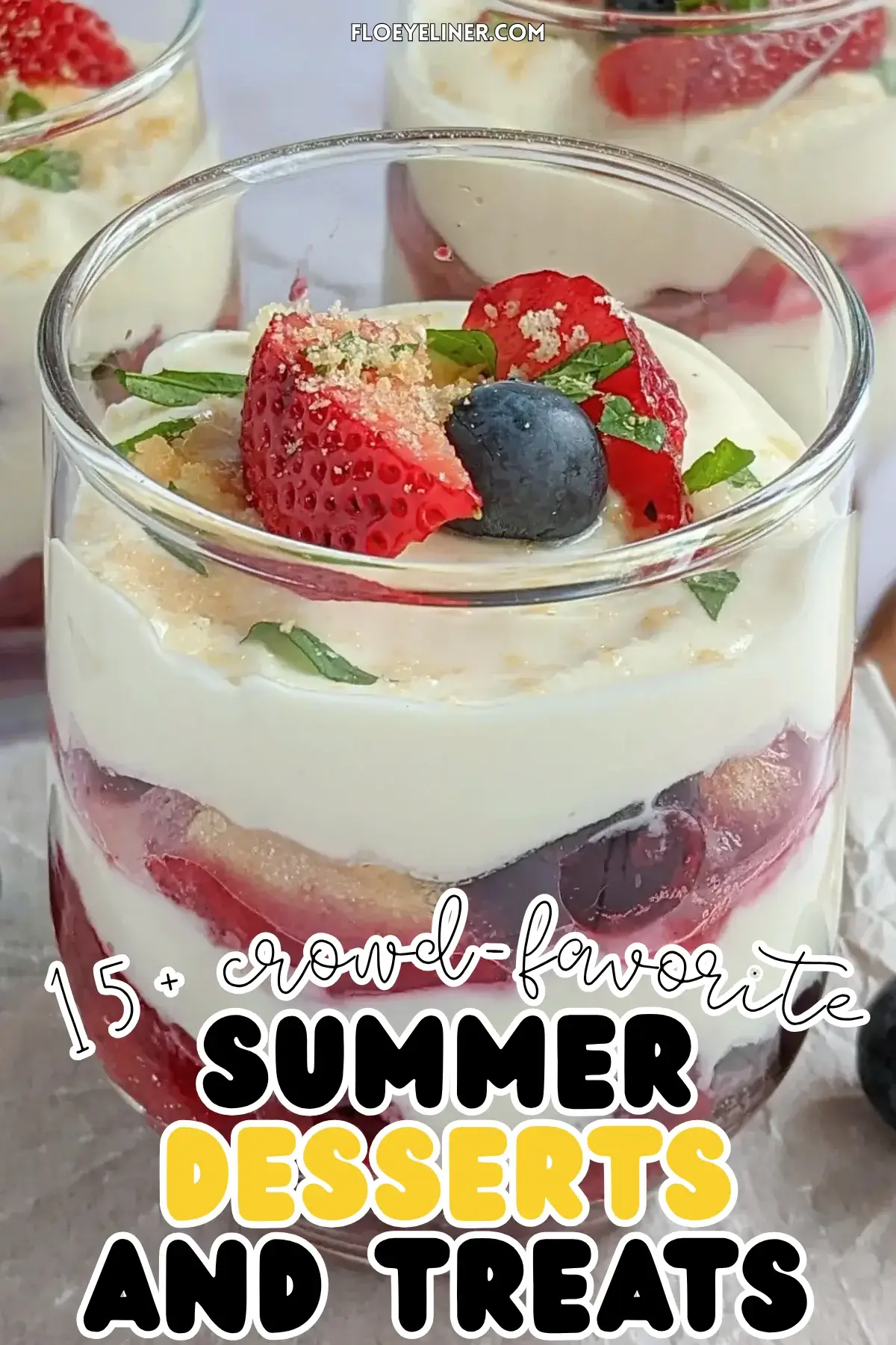 Mixed berry tiramisu in a glass dish with layers of mascarpone, Greek yogurt, and cooked berries like blueberries and strawberries.